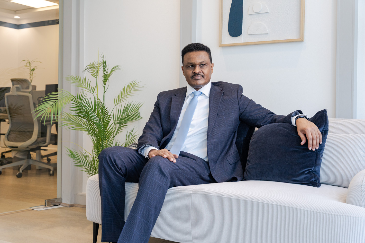 Elsir Badri seated in his Dubai office