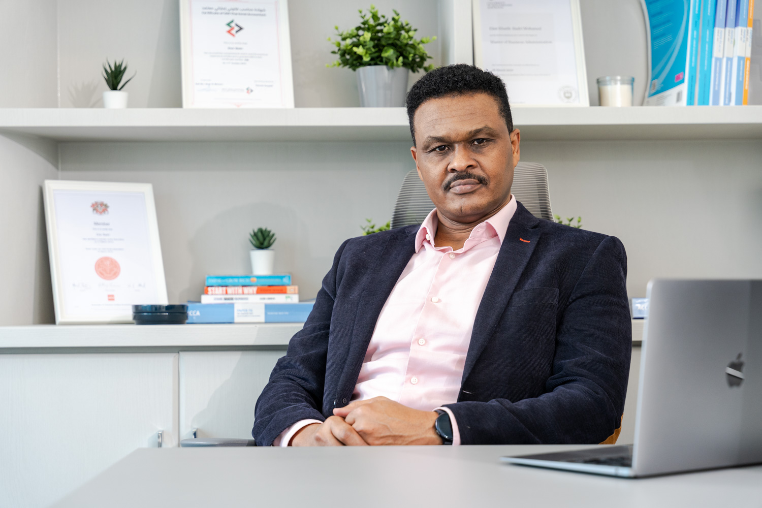 Elsir Badri seated in his office